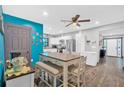 Bright dining area with a large table, a ceiling fan and hardwood floors at 1965 Midway Rd, Douglasville, GA 30135