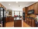 Modern kitchen with granite countertops, wood cabinets, stainless steel appliances, and breakfast nook at 3290 Winthrop Ne Cir, Marietta, GA 30067