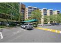 Apartment building entrance featuring covered awning with building number and designated parking spaces at 1800 Clairmont Lk # A427, Decatur, GA 30033
