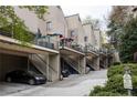Exterior view showing covered parking and staircase access to upper-level condos at 67 25Th Nw St # 5, Atlanta, GA 30309