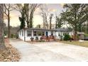 A charming single-story home featuring a long driveway and a beautifully maintained front yard at 1486 Akridge Nw St, Atlanta, GA 30314