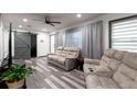 Bright living room features wood-look flooring and plush reclining sofas at 1486 Akridge Nw St, Atlanta, GA 30314