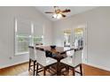 Cozy breakfast nook features hardwood floors, wainscoting, and a table set for four at 226 Double Gate Ct, Sugar Hill, GA 30518
