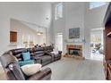 Spacious living room with fireplace, soaring ceilings, and ample natural light at 226 Double Gate Ct, Sugar Hill, GA 30518
