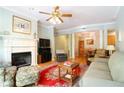 Bright living room features hardwood floors, fireplace, and an open layout leading to the dining area at 225 E Ponce De Leon Ave # 317, Decatur, GA 30030