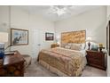 Cozy bedroom with neutral walls, a ceiling fan, and classic furnishings at 3300 Windy Ridge Se Pkwy # 612, Atlanta, GA 30339
