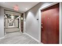 Neutral hallway outside apartment with wall to wall carpet and multiple doors leading to other apartments at 3300 Windy Ridge Se Pkwy # 612, Atlanta, GA 30339