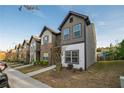 Street view of modern townhomes showcasing their architectural design and curb appeal at 2461 Bayrose Cir, Atlanta, GA 30344
