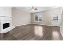 Bright living room with a fireplace and hardwood floors at 1730 Stanwood Nw Dr, Kennesaw, GA 30152