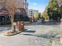 Gated entrance to a multi-story residential community on a sunny day at 4333 Dunwoody Park # 1211, Atlanta, GA 30338