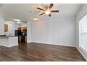 Bright living room featuring hardwood floors, a ceiling fan, and neutral wall colors at 4333 Dunwoody Park # 1211, Atlanta, GA 30338