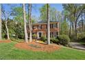 Inviting brick home with manicured landscaping and mature trees in a quiet neighborhood at 3141 Branford Ct, Marietta, GA 30062