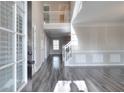 Spacious foyer features soaring ceilings, hardwood floors, and ample natural light through an expansive window at 3320 Gardenside Dr, Loganville, GA 30052