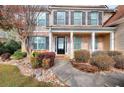 Inviting front entrance with brick facade, manicured landscaping, and walkway leading to the front door at 3320 Gardenside Dr, Loganville, GA 30052