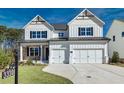Charming two-story home with white siding, black shutters, and a two-car garage at 3330 Hillshire Dr, Cumming, GA 30028