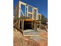 Framing view of a new home under construction including the foundation, basement, and wood support structure at 1236 Oakland Sw Ter # A, Atlanta, GA 30310