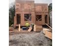View of the new home under construction, focusing on the wood framing and window placement at 1236 Oakland Sw Ter # A, Atlanta, GA 30310