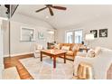 Light-filled living room showcasing neutral decor, wood floors, and cozy seating at 1309 Brookshire Ne Ln, Brookhaven, GA 30319