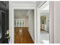 Inviting entryway with hardwood floors and views into the bright, open living spaces at 1323 Christmas Ne Ln, Atlanta, GA 30329