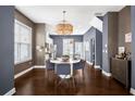 Dining area with stylish light fixtures, a modern table set, and neutral decor for a welcoming atmosphere at 2013 Rockledge Ne Rd, Atlanta, GA 30324