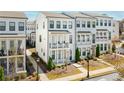 Elegant townhome showcasing a private balcony, pristine landscaping, and stylish architectural details in a sought-after community at 2013 Rockledge Ne Rd, Atlanta, GA 30324