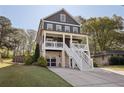 Charming two-story home with a covered porch, set amidst lush trees and an extended driveway at 2525 Reed Se St, Smyrna, GA 30080