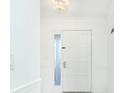Bright foyer with white walls and a modern light fixture, offering a clean aesthetic at 64 Saint Claire Ne Ln, Atlanta, GA 30324