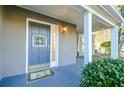 Charming entryway with a light blue front door, decorative wreath, and covered porch at 64 Saint Claire Ne Ln, Atlanta, GA 30324