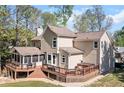 Spacious backyard with a large deck, screened in porch, and hot tub at 4103 Devon Wood Ne Dr, Marietta, GA 30066