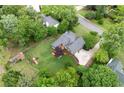 Aerial view of a landscaped backyard with mature trees, deck, and play structure at 434 Shepard Sw Dr, Marietta, GA 30064