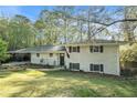 Charming two-story brick home with a manicured front lawn and a convenient carport at 539 Collingwood Dr, Decatur, GA 30032