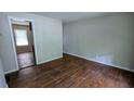 Inviting living room featuring original hardwood floors and neutral paint at 1076 Fairburn Nw Rd, Atlanta, GA 30331