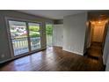 Bright living room with a front porch entrance and original hardwood floors at 1076 Fairburn Nw Rd, Atlanta, GA 30331