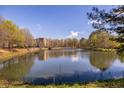 Scenic pond view offering a peaceful and serene natural setting surrounded by trees and the building at 1800 Clairmont Lk # 221, Decatur, GA 30033