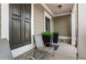Welcoming front porch featuring seating area, plants, and attractive decor at 3673 Madison St, Atlanta, GA 30337