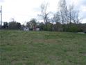 Expansive lot featuring lush greenery, a single-Gathering home, and a detached garage for ample parking and storage at 3915 Dahlonega Hwy, Cumming, GA 30028
