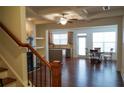 Bright and spacious living area with hardwood flooring, fireplace, and coffered ceilings at 5317 Radford Loop, Fairburn, GA 30213