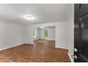Bright living room with hardwood floors and views to the front windows at 700 Thomasville Se Blvd, Atlanta, GA 30315