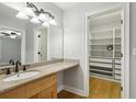 Bathroom with granite countertop vanity and walk in closet at 4430 Tilly Mill Rd # 1304, Atlanta, GA 30360