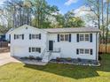 Charming painted brick split-level home with a manicured lawn, offering classic curb appeal at 294 Arnold Mill Rd, Woodstock, GA 30188
