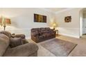 Cozy living room with comfortable seating and neutral decor for relaxation at 3169 Shadystone Way, Loganville, GA 30052
