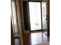 Front Door opens to a beautiful foyer with gleaming hardwood floors and an elegant glass-paneled door at 681 Nine Oaks Cir, Villa Rica, GA 30180