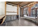 Open concept living space with exposed brick, high ceilings, custom shelving, and balcony access at 3235 Roswell Ne Rd # 801, Atlanta, GA 30305