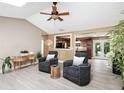 Open-concept living room with views to the kitchen, offering cozy seating and stylish decor at 3385 Huntington Ct, Douglasville, GA 30134