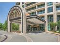 Building entrance with covered driveway and elegant design at 750 Park Ne Ave # 18S, Atlanta, GA 30326