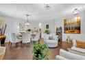 Bright living room with hardwood floors, decorative lighting, and stylish furniture at 8033 Louis Dr, Locust Grove, GA 30248
