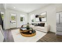 Bright living room featuring modern finishes, wood floors, and a large window at 1045 Mcdaniel St, Atlanta, GA 30310
