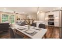 Inviting living space with hardwood floors, neutral walls, and bright windows to showcase an open floor plan at 2183 Seaman Cir, Atlanta, GA 30341