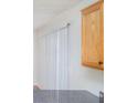 A kitchen corner has wood cabinets and a gray countertop at 2960 Fields Dr, Lithonia, GA 30038