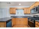 A well-equipped kitchen featuring stainless steel appliances, granite counters, and ample wood cabinets at 2960 Fields Dr, Lithonia, GA 30038